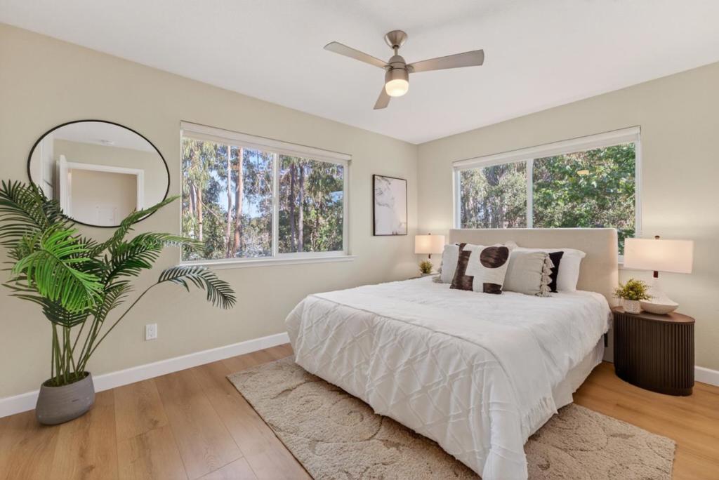 Move right in and start living the ultimate Santa Cruz beach life! This beautifully updated, top-floor, end-unit condo is perfectly situated just a few blocks from the sand, the Harbor, and some of the areas best restaurants, coffee shops, beaches and breweries. Step inside to find a bright, open living area that flows effortlessly into a modern kitchen featuring quartz countertops, stainless steel appliances, shaker cabinets, and a stylish tile backsplash. Enjoy morning coffee or evening breezes on your sunny private deck surrounded by mature trees and landscaped grounds. The primary bedroom overlooks Schwan Lagoon, has multiple windows and includes a large walk-in closet. The community offers resort-style amenities including a pool, gym, clubhouse, multiple BBQ areas and open green spaces. Whether you're looking for a primary home or a weekend coastal retreat, this one has it all; style, comfort, and that signature Santa Cruz vibe. Welcome home!