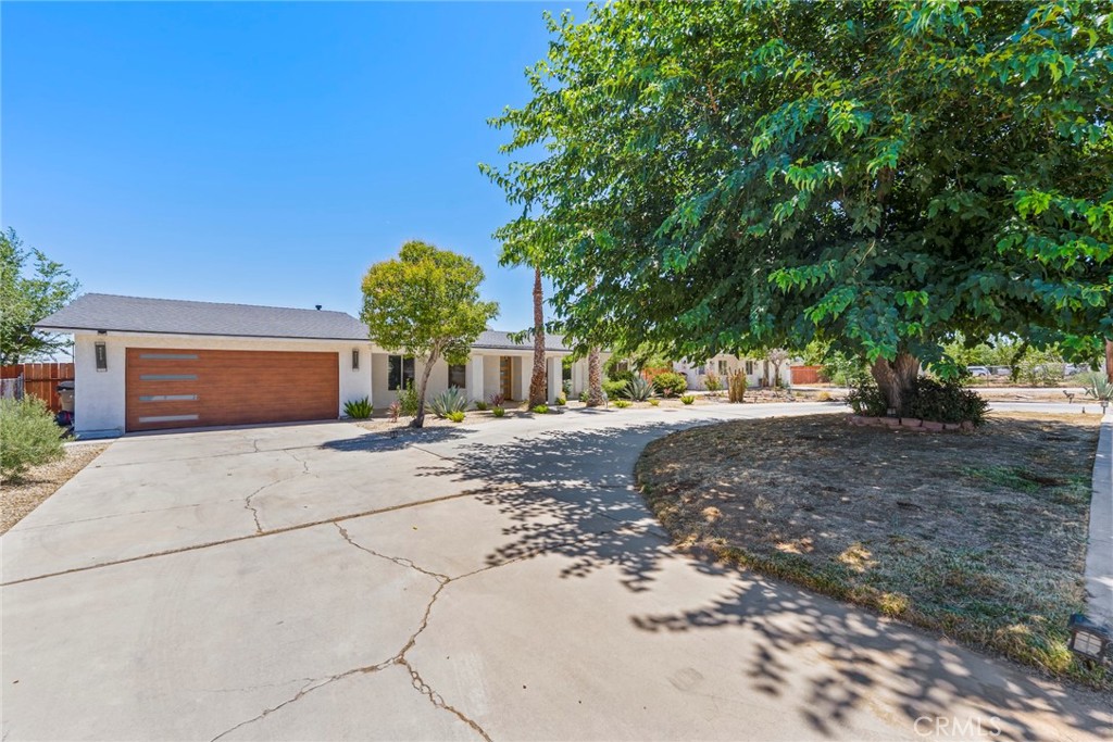 Imagined having your own personal paradise, with rental income? This unique property is perfect for entertaining ! 2 HOMES ON A CORNER LOT, A POOL & JACUZZI, TENNIS COURT ! BASKETBALL COURT, BBQ area, 2 outdoor showers to clean off after recreational activities. Sits on over 1. acre of land with 3 RV access entries, fully enclosed with privacy fencing, and Cedar wood fencing, mature trees and lots of shade. Main house is a 3 bedroom, 2 full bath. 2,108 sqft. has a wide open concept, with recessed lighting, huge granite countertop, a chef's Kitchen, living room with lots of windows for natural light, 2 extended glass sliders doors, fire place, and dining area. Bathrooms have been upgraded with luxurious Italian porcelain tile, jet showers, and a jetted spa bathtub. Master bedroom has a walk-in closet, mirror doors and a lager glass slider leading to the outside patio & pool area. THE SECOND HOME is 3 bedroom, 1 full bath, 1,120 sqft. with a kitchen. Both homes have undergone extensive renovations with city permits. Everything in these two homes are less than 2 years old from the plumbing and electrical systems to the drywall, new roofing, flooring, showers, windows, garage doors, and LED lighting. Thers’s also a bonus HUGE room in the back that was converted into a recording studio. The list of amenities goes on and on. Don't miss out on this incredible opportunity, conveniently located in the heart of Hesperia, at the intersection of Ranchero and Main Street.