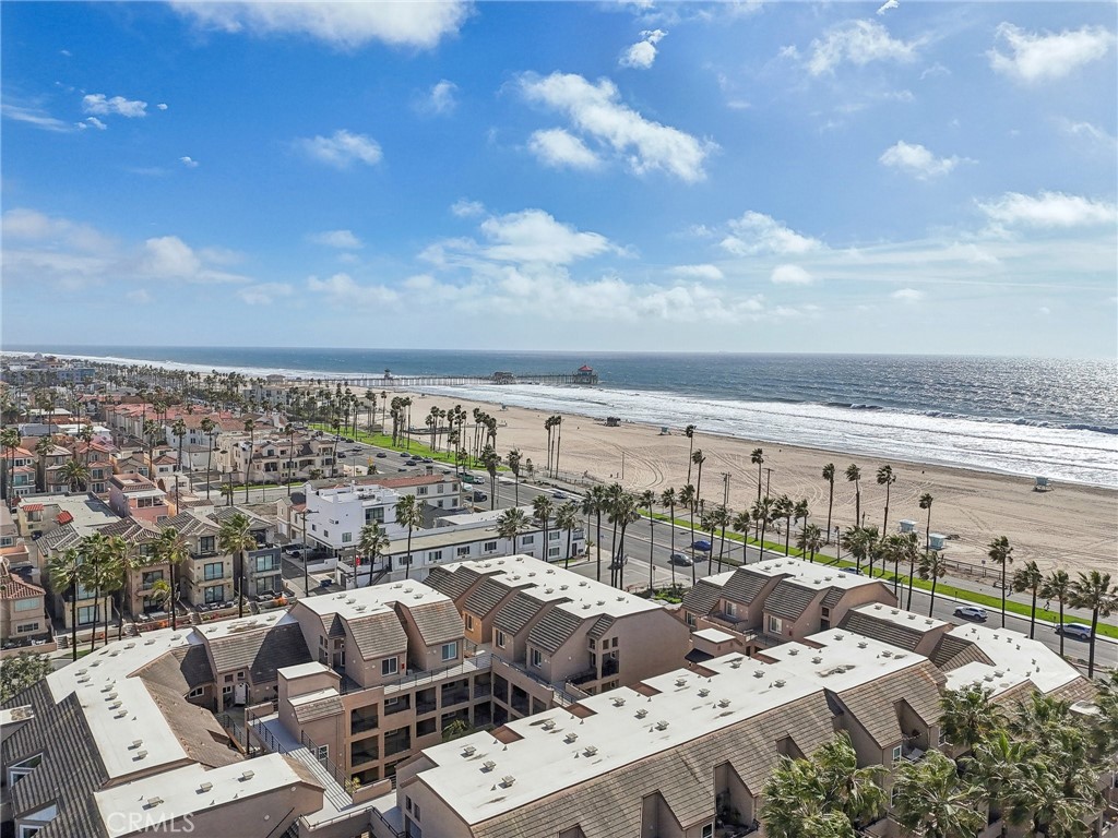 Welcome to your own slice of paradise in the world-famous Huntington Beach—where the vibrant coastal lifestyle and endless ocean views come together in perfect harmony. Nestled in the heart of downtown, this top-floor penthouse condo places you just steps from Main Street and the iconic Huntington Beach Pier, offering premier access to shopping, dining, and year-round entertainment. Located in the highly sought-after Pierhouse community, this light-filled 1-bedroom, 1-bathroom home boasts soaring cathedral ceilings and floor-to-ceiling windows that frame stunning ocean and sunset views. The open-concept layout features a stylish kitchen with granite countertops and a spacious living room that opens to a private balcony—ideal for enjoying your morning coffee or relaxing as the sun sets over the Pacific. Resort-style amenities include a beachfront pool and spa with panoramic views of Catalina Island, a BBQ area and clubhouse for entertaining, secure gated entry, and underground parking with two assigned spaces, a large storage bin, and community bike storage. HOA dues include hot water, trash, and cable for added convenience. Whether you're looking for a luxurious weekend retreat or a full-time oceanfront residence, this beautifully upgraded penthouse offers comfort, convenience, and unparalleled beachside living—all just steps from the sand. Don’t miss your chance to own this rare gem and live the Surf City dream!