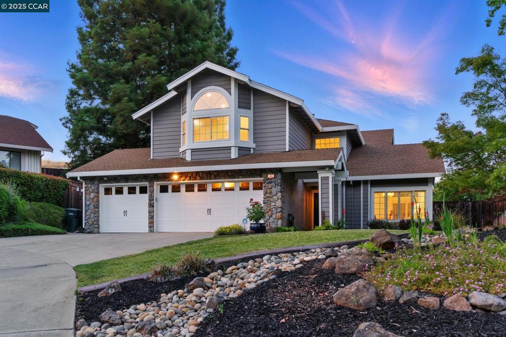 Tucked away at the end of a peaceful cul-de-sac, this beautifully updated 5-bedroom, 3-bathroom home offers 2,352 sq ft of flexible living and backs to tranquil green space for exceptional privacy and views. The inviting curb appeal leads to a spacious interior with vaulted ceilings, a dramatic staircase, and an upgraded kitchen featuring granite counters and stainless steel appliances. The functional floorplan includes a full bedroom and bathroom downstairs—perfect for guests or multigenerational living. Upstairs, the fifth bedroom offers endless possibilities as a large bonus room, game room, or home theater. Recent upgrades include dual-pane windows, hardwood floors, fresh carpet, exterior and interior paint, and remodeled bathrooms. Enjoy nearby trails and Hidden Lakes Park just moments away. With a 3-car garage, top-rated schools, and a private entertainer’s backyard, this home blends comfort, versatility, and an unbeatable location.