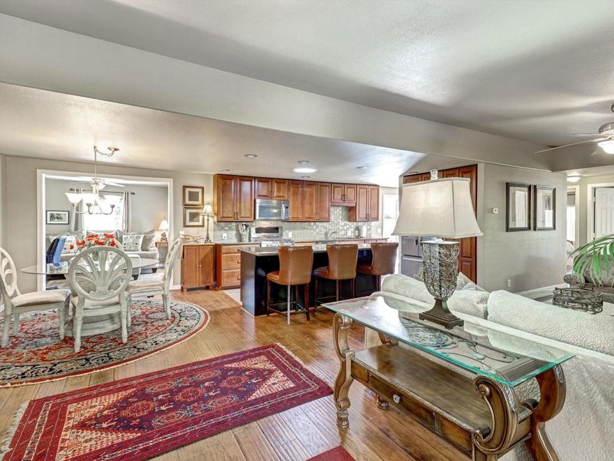 Welcome to desert living at its finest in this stunning 3-bedroom, 2-bathroom manufactured home spanning 1,560 square feet of thoughtfully designed space. This completely renovated treasure seamlessly blends indoor and outdoor entertainment with an open floor plan that flows effortlessly throughout. The heart of this home features a spectacular granite island that's practically begging for your next dinner party or casual morning coffee. Whether you're whipping up a feast or just need extra workspace, this kitchen centerpiece delivers both style and functionality. A cozy fireplace offers warmth and ambiance to the living area, creating the perfect gathering spot for family and friends. The split floor plan offers ultimate privacy, with the luxurious primary bedroom featuring an immense walk-in closet and an impressive tile shower that transforms your daily routine into a spa-like experience. Two ADDITIONAL bedrooms PLUS a dedicated office space provide flexibility for work-from-home needs, guests, or hobby rooms. Storage enthusiasts will appreciate the abundant built-in storage solutions throughout the home. Double-pane windows ensure year-round comfort while maintaining energy efficiency. Step outside to your private oasis featuring a gorgeous Pebble Tec saltwater pool and spa with elegant water features. Retractable sun blinds provide customizable shade, while an outdoor shower adds convenience for post-swim refreshing. The extremely private outdoor space is perfectly designed for entertaining, from intimate gatherings to larger celebrations. Located near renowned Eisenhower Health and the upscale El Paseo Shopping District, you'll enjoy convenient access to world-class medical care, dining, and retail therapy whenever the mood strikes. Living in this wonderful community means enjoying low homeowners' association dues that surprisingly cover FREE golf, free internet and trash pickup, a clubhouse with a restaurant, a lounge, 18-hole executive golf course and pro shop, three community pools, hot tubs and an exercise room. Add a billiard room, card room, indoor shuffle board, tennis courts, pickle ball courts, library, recreation room, and many active clubs to realize all that PDGCC offers for your perfect desert home. With a variety of activities, every day can be as active or relaxed as you desire. This incredible home won't last long! Please call for a showing.