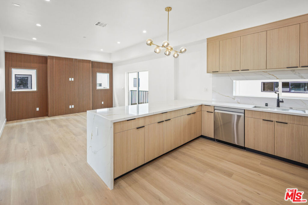 **BRAND NEW CONSTRUCTION ** PRIVATE ROOFTOP DECKS ** 2-CAR PRIVATE GARAGE ** WASHER/DRYER ** CENTRAL A/C ** KITCHEN ISLAND ** PET FRIENDLY ** Welcome to Hortense Townhomes, a brand-new luxury residence in the heart of North Hollywood offering high-end finishes, spacious interiors, and unbeatable amenities. These thoughtfully designed units feature expansive living rooms, oversized bedrooms, and open-concept layouts perfect for modern living. The chef's kitchen boasts a large island, beautiful stainless steel appliances, quartz countertops, and custom cabinetry. Each unit includes an in-unit washer and dryer, central A/C and heat, recessed lighting, and premium flooring throughout. Enjoy your own private garage plus an assigned parking space for added convenience. The building is pet-friendly and offers an incredible shared rooftop deck with sweeping city views for relaxing, entertaining, or working from home in style. Located on a quiet residential street yet minutes from the vibrant NoHo Arts District, Toluca Lake, studios, shops, restaurants, and transit. This is elevated urban living at its finest. Don't miss your opportunity to call it home!
