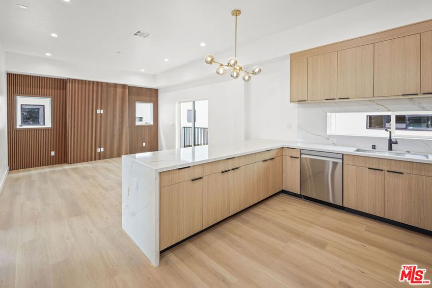 **BRAND NEW CONSTRUCTION ** PRIVATE ROOFTOP DECKS ** 2-CAR PRIVATE GARAGE ** WASHER/DRYER ** CENTRAL A/C ** KITCHEN ISLAND ** PET FRIENDLY ** Welcome to Hortense Townhomes, a brand-new luxury residence in the heart of North Hollywood offering high-end finishes, spacious interiors, and unbeatable amenities. These thoughtfully designed units feature expansive living rooms, oversized bedrooms, and open-concept layouts perfect for modern living. The chef's kitchen boasts a large island, beautiful stainless steel appliances, quartz countertops, and custom cabinetry. Each unit includes an in-unit washer and dryer, central A/C and heat, recessed lighting, and premium flooring throughout. Enjoy your own private garage plus an assigned parking space for added convenience. The building is pet-friendly and offers an incredible shared rooftop deck with sweeping city views for relaxing, entertaining, or working from home in style. Located on a quiet residential street yet minutes from the vibrant NoHo Arts District, Toluca Lake, studios, shops, restaurants, and transit. This is elevated urban living at its finest. Don't miss your opportunity to call it home!