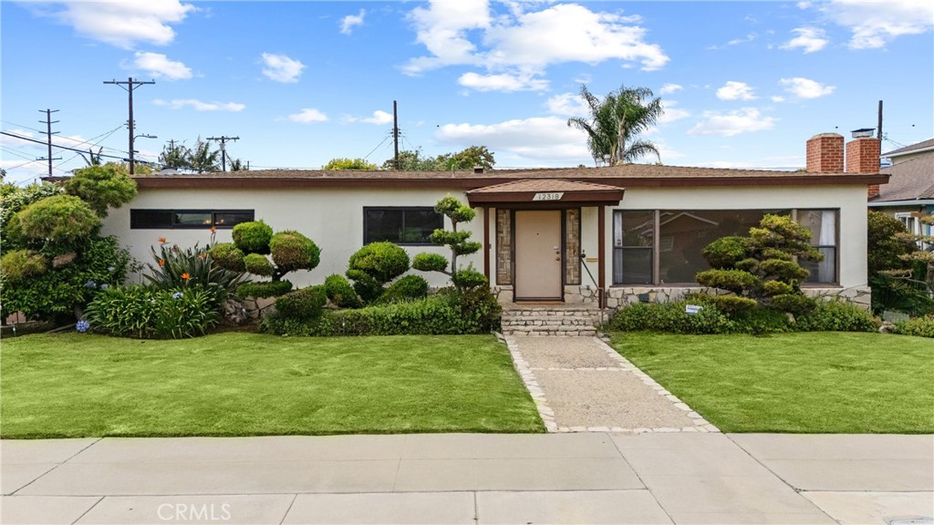 Welcome Home to 12319 Aneta St, Culver City, CA 90230- Experience coveted Silicon Beach living in this spacious single level SFR featuring 4 beds, 3 baths, living room with large picture window, updated kitchen, formal dining room, den, sunroom/ enclosed lanai, new paint throughout, copper plumbing, attached direct access 2 car garage with washer/dryer, grassy backyard. The living room features new recessed lighting, large picture window, fireplace; Kitchen is a chef's delight featuring large center island, ample cabinets, custom shelving, stainless steel appliances (refrigerator, in wall-oven, in wall microwave, gas range and range hood, dishwasher), new recessed lighting, additional butler's shelving, built in desk. Through French doors you'll find the formal dining room. The spacious den has built in shelving, and leads to both to the attached 2 car garage and into the sunroom through sliding glass doors. The backyard features citrus and persimmon trees, roses, and grassy space. The spacious primary bedroom features multiple closets, an en-suite bath with dual vanity, separate tub and shower, and privacy toilet. It also has access into both the sunroom and a library/ study with built-in shelving (that could also be used as a large walk-in closet). On the east side of the house bedrooms 2 & 3 have ample closets and a hallway bath with full tub and shower. On the west side of the house there is the 4th bedroom and full bathroom with edison lights, separate tub and shower - it feels like it's own private wing of the house! Conveniently located in close proximity to the restaurants, shops, Whole Foods, farmer's market at Runway Playa Vista, the Award Winning Playa del Rey Elementary School, LAX, the beach, Marina Del Rey, and easy access to freeways for commutes.