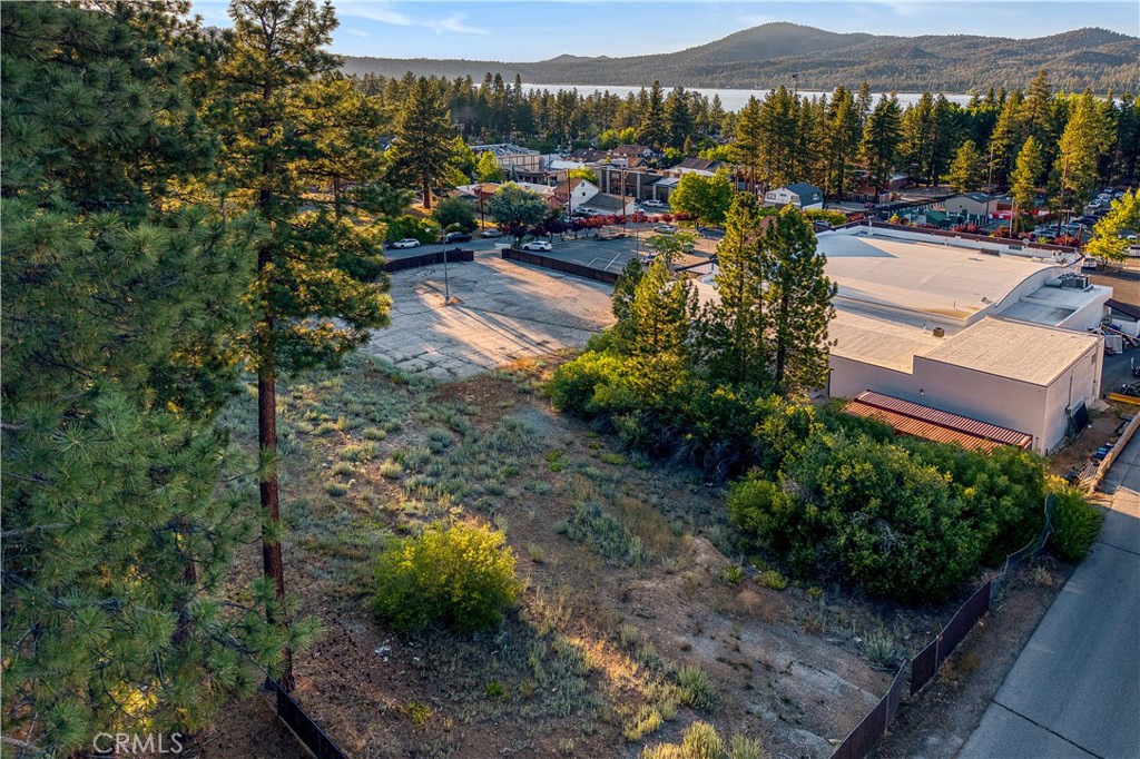 The last remaining commercial development acreage lot in Big Bear Lake Village.
Situated in one of Southern California's premier year-round tourist destinations, this 1.13-acre, high-visibility parcel is just steps from the Village shops, dining, and entertainment. Spanning street-to-street from Knickerbocker to Stocker Roads, this rare offering presents outstanding development potential under Neighborhood Commercial zoning in the Village Specific Plan.
Whether you're envisioning commercial spaces, multi-family housing (duplexes, 4-plexes, or potentially up to 13 units depending on design and footprint), or a mixed-use project, the versatility of this site supports a wide range of possibilities. All utilities are available at the street.
Endless opportunity in a prime Village location.