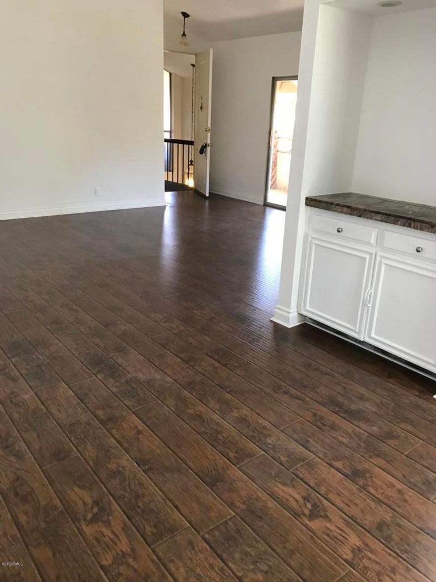 Westpark Condos in the heart of Westlake Village. Remodeled End Unit - Open floor plan.  Wood/like flooring, blinds installed, stove and dishwasher. Baths remodeled.  High ceilings. Travertine flooring in baths and kitchen.  Two car ports. Beautiful grounds with Pool, Spa, BBQ area.