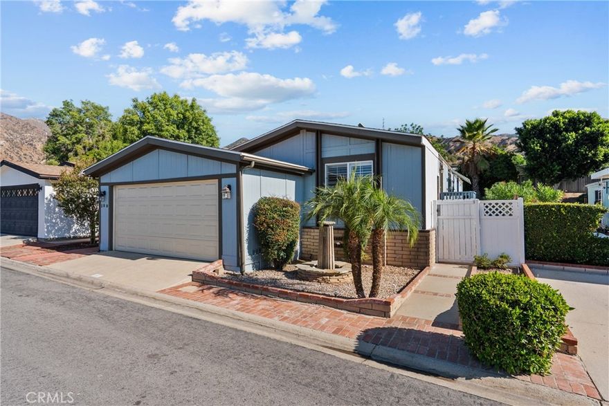 Step into your new home nestled within the desirable Oakridge Community of Sylmar. This cozy yet spacious 2-bedroom, 2-bath home offers 1,104 sq. ft. of light-filled living space designed for comfort and style. The upgraded kitchen features new quartz countertops, stainless steel appliances, and a center island that opens seamlessly to the inviting living room, perfect for entertaining or relaxing at home.



Outside, enjoy your morning coffee on the charming front porch or host gatherings in the large, landscaped, fully fenced backyard that offers both privacy and beauty. Additional features include a two-car garage, guest parking close to the house, and breathtaking mountain views.



Community amenities include a resort-style pool and spa, tennis and pickleball courts, a fitness center, library, billiard room, and banquet facilities, plus guard-gated security for peace of mind. With a warm and welcoming neighborhood atmosphere, every day feels like a retreat in the Oakridge Community.