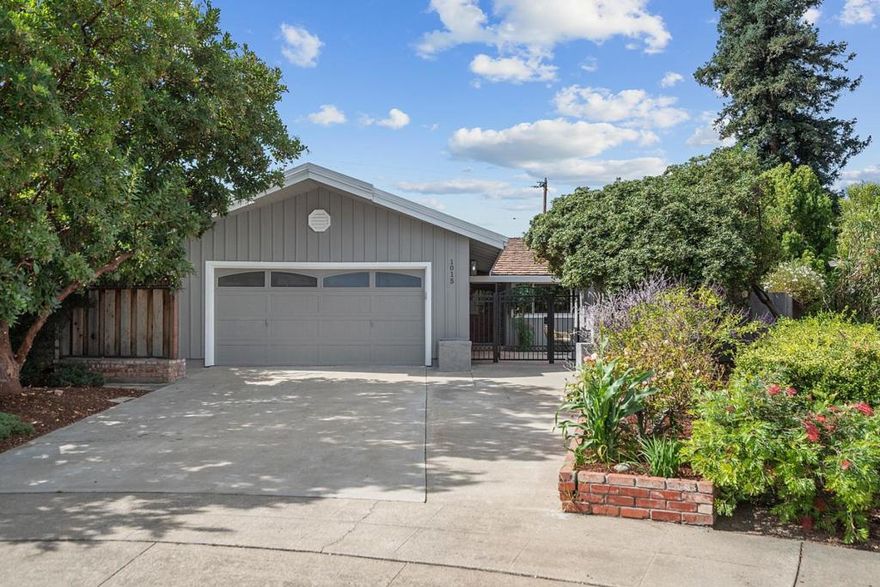 Light-filled cul-de-sac home near Apple Park. Less than a mile from Apple Park and a short drive to Google and LinkedIn, this home combines modern style, flexible spaces, and a coveted location at the end of a cul-de-sac. The chef's kitchen features a large island with five-burner gas cooktop, stainless steel appliances, and quartz countertops with matching backsplash. It flows seamlessly into dining area with bay window and built-in china cabinet, then into the bright living room with wall-to-wall windows and sliding doors opening to paved patio. Extended family room with wet bar and oversized windows offers space for entertaining, game nights, or even a fourth bedroom. The primary suite boasts walk-in closet, dual sinks, and access to backyard deck, while the hall bath charms with custom tilework and lovely arched window over the tub. Multiple outdoor areas make the most of California living. Gated front courtyard; side yard with arbor; and lush backyard retreat shaded by mature redwoods, maples, and fruit trees. Private gate opens directly to 11.9-acre Raynor Park with basketball courts, dinosaur-themed play structure, reservable event space, and more. Students have access to excellent schools-Laurelwood Elementary, Peterson Middle, and Wilcox High (buyer to verify).