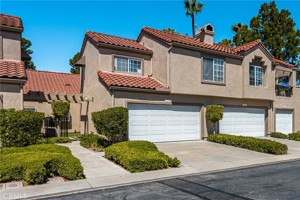 A hidden jewel in Mission Viejo! Rare 3 bedroom floorplan with two primary suites and a spacious loft gives you 4 full rooms to enjoy. Recently updated luxury vinyl floors and renovated kitchen with stainless steel appliances, a gorgeous garden window, and stunning countertops. Two car attached garage with ample storage and one of the few models with a full 2 car driveway. High vaulted ceilings in the spacious open living room leads out to the large yard with direct access to the green belt (which offers a spectacular view of the 4th of July fireworks) as well as a sizeable private gated front yard walkway. This property feels like a single family home and is just a short walk from the lake. The community offers a pool, two spas, two tennis courts and a membership to Private Lake Mission Viejo. The lake offers free concerts, swimming, boat rentals, fishing and picnic area. Plan on making lots of memories in your new home by the lake!