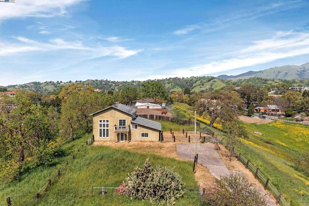 Exclusive 2.72-Acre Hilltop Estate with Panoramic Views Discover the rare opportunity to own a 2.72-acre hilltop sanctuary boasting breathtaking, unobstructed views of Mt. Diablo and the surrounding rolling hills. This private retreat offers the ideal canvas for an architecturally stunning estate, equestrian haven, or luxury vineyard setting. The property includes a barn partially converted into a 1,943 sq. ft. residence, offering immediate functionality while you design and build the residence of your dreams. For those seeking a true legacy property, the neighboring parcel—with an additional home—is also available. Together, these properties create the ultimate family compound or multi-generational estate.