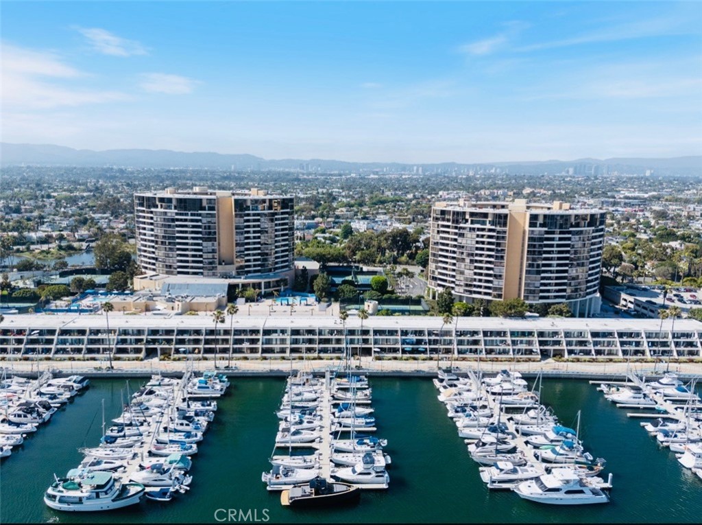 **Panoramic Views & Resort-Style Amenities** Experience coastal living at its finest in this sleek and stylish condo located in the highly sought-after Center Tower South of the iconic Marina City Club. Enjoy breathtaking, unobstructed Marina and ocean views through floor-to-ceiling windows and sliding glass doors that flood the home with natural light. Step out onto your spacious private balcony—perfect for entertaining or simply soaking in the sunset.
This light, bright, and airy residence features an open floor plan with a spacious great room and upgraded laminate flooring throughout. The gourmet kitchen boasts granite countertops, and stainless steel appliances. Live in a 24/7 guard-gated community offering an unmatched suite of amenities:
• Three year-round heated swimming pools
• Six tennis courts, three racquetball courts, and two paddle tennis courts
• Pickleball, a 16,000 sq ft state-of-the-art gym, and free classes including yoga, Pilates, and more
• On-site spa, beauty studio, dry cleaning, car wash, and convenience store
• Two restaurants, a café, full bar with room service, and maid service available
Ideally located just 15 minutes from LAX and within walking distance to Mother's Beach, Venice Pier, Abbot Kinney, Trader Joe’s, Ralphs, and countless shops, restaurants, and parks—including a bustling farmer’s market every Saturday. The area is rapidly growing, offering even more retail and dining options on the horizon.
Monthly fees total ~ $1,600, including ground rent and HOA dues.
Don't miss this rare opportunity to own a piece of Marina Del Rey luxury with an unbeatable combination of waterfront tranquility and urban convenience. Schedule your private tour today and make this coastal gem your own!