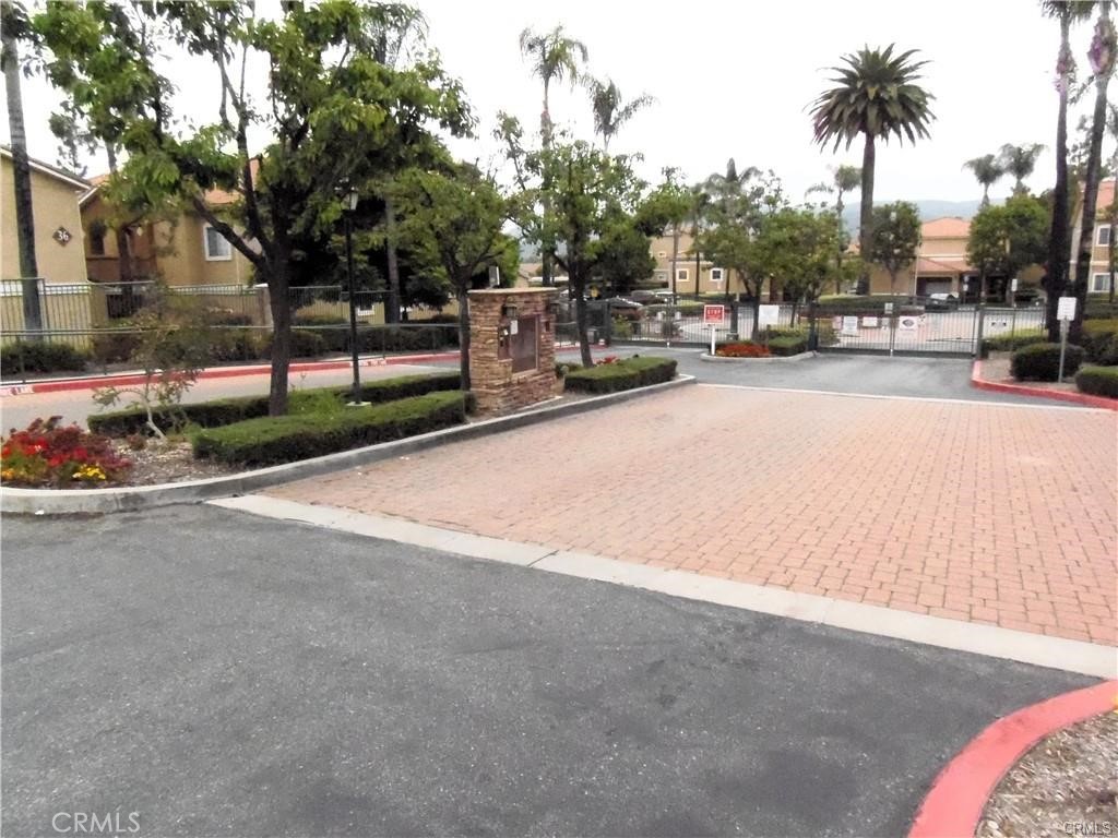 Seller will entertain offers between $459,000.00-$479,000.00Fabulous and highly upgraded hard to find lower level condo with 3 bedrooms and 2 baths and attached 2 car garage with direct access to the unit, and one car carport in a beautiful complex with great amenities, pool,spa and gym! Living and Dining area with open kitchen. Upgraded kitchen with Newly installed quartz, and light fixtures. Crown molding in master bedroom,wood like flooring and it is very light and open. All bedrooms have walk in closets. Indoor Laundry. Centrally located near shopping and schools,theater and upscale restaurants.