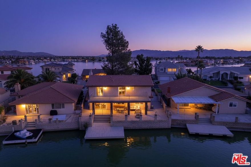 Charming Waterfront Retreat in Spring Valley Lake. Nestled along the serene shores of a picturesque lake, this stunning waterfront house offers a perfect blend of modern comfort and natural beauty.  The open-concept design features large windows that flood the space with natural light, showcasing incredible lake views. The master suite boasts a private balcony overlooking the water, providing a tranquil retreat. A well-appointed kitchen with modern appliances, ample counter space, and a cozy breakfast nook, perfect for family gatherings.This waterfront house is ideal for both relaxation and entertainment.