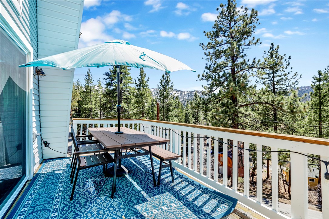 Stunning Mountain Home with incredible views in Desirable Moonridge Location. Welcome to this beautiful 3-bedroom, 2-bathroom single-family home, offering 2,020 sq. ft. of living space on an expansive 8,410 sq. ft. lot in the highly sought-after Moonridge neighborhood. Designed with mountain modern elegance, this home boasts breathtaking mountain and ski slope views, providing the perfect retreat for year-round enjoyment. Step inside and be greeted by an open, airy layout, abundant natural light, and a warm, inviting atmosphere. The third bedroom is currently being used as a theater & game room, offering versatile space that can be easily converted to suit your needs. This home features an EV Charger, Upgraded Electrical Panel, New Flooring in Living Room & Kitchen, Newer roof and recently installed A/C. Expansive decks surrounding the home are ideal for outdoor entertaining, the hot tub invites you to relax and unwind while taking in the stunning surroundings. For a true connection with nature, escape to the enchanting A-frame cottage tucked away in the woods. This unique property is not to be missed.