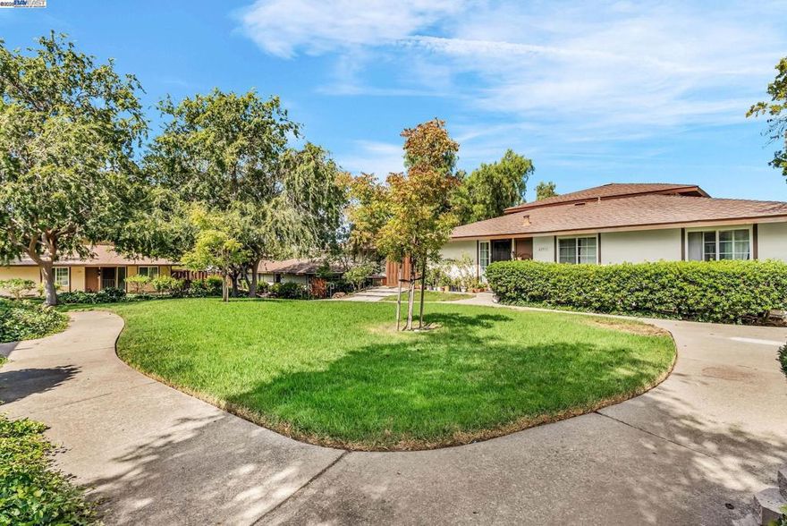 ** OPEN Sat/Sun from 2-4pm** Absolutely STUNNING unit in Mission San Jose's Golden Triangle, just minutes to all 3 schools: Chadbourne Elementary, Hopkins Jr High, and Mission San Jose High! This UPDATED single story townhome is positioned perfectly in the center of the highly sought-after Valle de la Paz community. The END UNIT location draws in more natural light, making this home feel bright, warm, and inviting. Some of the highlights include: Updated kitchen with quartz counters and matching backsplash, shaker-style cabinets, recessed lighting, and stainless steel appliances * Refreshed bathrooms * Laminate wood floors * In-unit laundry * and SO much more. The spacious and private patio is a great place to enjoy a morning coffee or unwind after a long day. The community boasts a club house, heated swimming pool, hot tub, and a well-manicured greenbelt for afternoon walks. Located for convenience and lifestyle, enjoy easy access to Whole Foods, Sprouts, Fremont HUB, plenty of shopping and dining, AND Fremont's TOP RATED schools! Nestled perfectly near 680/880 freeways and Fremont BART make this home a commuters dream. This is not a MUST SEE, this is a MUST HAVE!