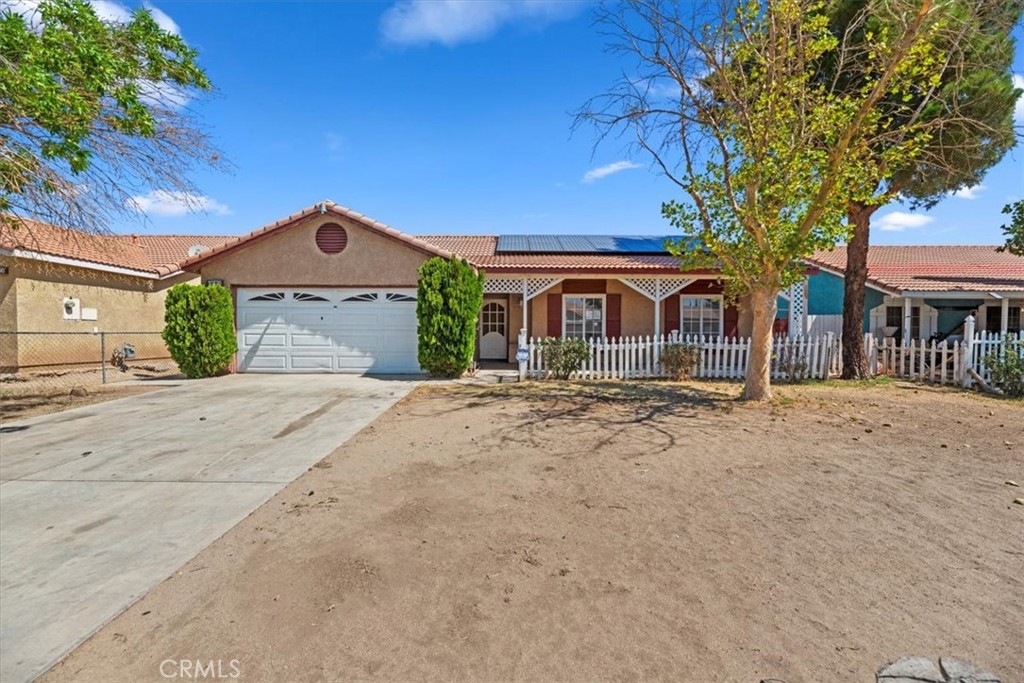 Welcome to this Ranch style home in the heart of Adelanto. This 3-bedroom, 2-bathroom home is ready for your personal touch! Featuring a living space with a cozy fireplace and open to the kitchen that offers tile floors, high ceilings. The secondary bedrooms are ready for customization, to give you the opportunity to add your own style. Guest bathroom features a walk in tub, and primary bedroom has a combo shower and tub. Enjoy the convenience of a 2-car garage and a nice sized lot entertaining a wood-fenced back yard, perfect for outdoor activities or privacy. This home can be the perfect canvas for your dream living space! Book your tour today!