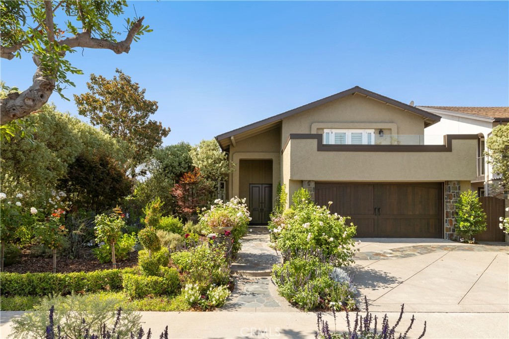 A rare opportunity in the heart of Los Alamitos! From the curb, this home makes a statement with a professionally landscaped Huntington-style yard, slate walkways, and a smart irrigation system that keeps it picture-perfect year-round. Inside, rich custom woodwork and luxurious upgrades set the tone, while the chef’s kitchen flows seamlessly into light-filled living and dining spaces designed for gathering. The primary suite is a spa-like retreat, and every room has been styled with both comfort and sophistication. Step into the backyard and find an entertainer’s paradise—an outdoor kitchen fully outfitted for weekend barbecues, cocktail nights, or sunset dining. Best of all, this home sits within the award-winning Los Alamitos School District, offering not just a residence, but a lifestyle in one of Orange County’s most coveted communities.