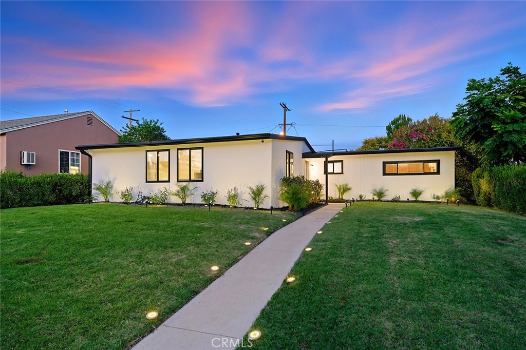 Step into style, comfort, and endless potential with this fully remodeled 3-bedroom, 3-bath mid-century modern gem in the heart of Valley Glen! From the moment you enter, you'll be drawn to the stunning wood paneled ceiling, and spacious open layout designed for modern living while keeping some of the original charm throughout the home! The updated kitchen features sleek finishes and modern appliances, while a newer central HVAC system ensures year round comfort which is also paired with a mini split in the primary bedroom to save on energy costs while you aren't using the other areas of the home. All three bedrooms are generously sized, including the primary suite which has an extra private lounge area! The home also boasts a convenient interior laundry room which shares a full bathroom and shower perfect for guests or when hosting in the backyard since it has its own access door leading to backyard! The fenced front yard creates a safe, welcoming space that’s perfect for kids or pets, while the LARD2-zoned lot with gated alley access opens the door to future possibilities such as an ADU or another unit! The backyard also has the perfect opportunity to add a carport (buyer to verify). This location is hard to beat... close to Ventura Blvd, Studio City, Valley Village, and major freeways, this home offers the best of both peace and accessibility. Furniture and appliances may be included with the right offer, making this a rare turnkey opportunity packed with charm, flexibility, and room to grow!