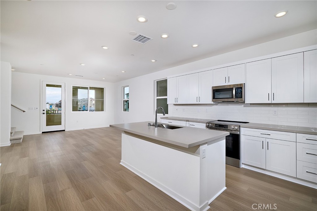 Just Got More Affordable – Don’t Miss This Deal! Welcome to this stunning three-level detached home at Fairfax, thoughtfully designed for both comfort and style. The first floor features a spacious two-car garage, a dedicated office or study space, and a welcoming entryway. The second floor boasts an open-concept layout with a bright and airy great room that extends to a covered deck, a modern kitchen with a generous island and pantry, a dining area, and a convenient powder room. Upstairs, the third floor offers a serene primary suite with an en-suite bath and walk-in closet, two additional bedrooms with ample storage, a second full bath, and a centrally located laundry area. Blending functionality with elegant finishes, this home is perfect for modern living. Eastvale Square offers resort-style amenities designed for relaxation and recreation. Picture yourself lounging by the sparkling pool, unwinding in the soothing spa after a workout in the state-of-the-art fitness center, or enjoying quality time at the inviting clubhouse. Kids will love the vibrant playground, while adults can gather around BBQ grills and cozy firepits for unforgettable evenings. Stroll through scenic paseos, enjoy picnics in lush green spaces, or let your furry friends play in the dedicated dog park. For sports enthusiasts, a half basketball court adds to the fun. Experience the perfect blend of adventure and tranquility in this dynamic community.