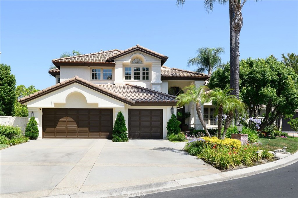 Private Luxury Living in Coto de Caza. Tucked away and set on a quiet single-loaded cul-de-sac in the prestigious guard-gated community of Coto de Caza. This 4,000 sq ft residence offers elegance, privacy, and high-end comfort on a spacious 9,100 sq ft lot. From the charming covered front porch to the striking double door entry, this home impresses from the start. Inside, the thoughtfully designed floor plan features extensive hardwood flooring, soaring vaulted ceilings, and a dramatic sweeping staircase. The formal living and dining rooms are light, bright and welcoming, with large windows framing serene views. At the heart of the home is a gourmet kitchen with warm wood cabinetry, a large center island, stainless steel appliances, a cozy breakfast nook, and a generous walk-in pantry. French door leads to a covered patio with a firepit, ideal for relaxing evenings and outdoor dining. The expansive family room includes custom built-ins, a stack stone fireplace, and more French doors that open to the lush backyard oasis with golf course views. A main floor bedroom with a private full bath adds flexibility for guests or extended family. Upstairs, the primary bedroom is a private retreat with vaulted ceilings, a sitting area with a dual-sided fireplace, and a view balcony that catches cool evening breezes. The spa-style bathroom offers a soaking tub, walk-in shower, dual vanities, and two walk-in closets. Two additional oversized bedrooms share a Jack-and-Jill bath. An entertainers dream backyard is designed for entertaining, featuring a saltwater pool and spa, built-in BBQ, Sonos outdoor sound system, customizable lighting, and plenty of covered patio space. Enjoy resort-style living with membership options to Coto de Caza’s renowned golf and racquet club. Enjoy the equestrian and hiking trails, parks, and award-winning schools. This turnkey home is loaded with upgrades and impeccable finishes—luxury living at its finest.