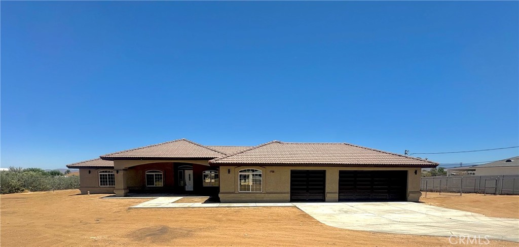 Welcome to this gorgeous 5-bedroom, 4-bathroom home, just under 3000 sq. ft. of single-level living on a generous 44,866 sq. ft. fenced lot in Hesperia. This property boast a split floor plan, perfect for modern living. The kitchen features granite countertops, built-in appliances, and a convenient walk-in pantry. Separate Family Room w/ Fireplace. Formal Dining, Formal Living Room & Breakfast Nook. This home also offers two primary bedrooms with adjoining bathrooms. Indoor Laundry & three car garage, as well. Additionally, the expansive lot provides for a potential ADU ( Additional Dwelling Unit), making this property an excellent choice for multi-generational living. Commuter Close. This Beautiful Home has recently been painted and new carpet installed and is ready for you to move right in!
