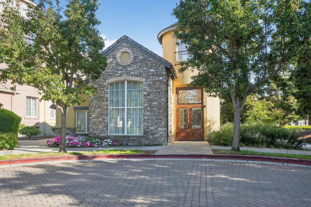 Welcome to The Sonora, a resort-style gated community in the heart of Silicon Valley. This spacious 2-bedroom, 2-bath condo offers 1,133 sq. ft. of thoughtfully designed living space with modern upgrades throughout. The open floor plan features a bright living room with balcony access, an upgraded kitchen with quartz countertops, stylish cabinetry, stainless steel appliances, and in-unit laundry. Each bedroom is a private retreat with a walk-in closet and its own full bath, perfect for homeowners, guests, or roommates. The Sonora is known for its resort-style amenities, including a clubhouse with a catering kitchen, an air-conditioned fitness center, a heated pool and spa, BBQ and gathering areas, a business center with free Wi-Fi, and rentable guest suites including the game room. Two reserved underground parking spaces are included for convenience and parking ease. Conveniently located near SJC Airport, major freeways, tech campuses, shopping, and dining, this condo combines comfort, convenience, and lifestyle in one. Your opportunity to own a beautifully updated home in one of San Jose's most desirable communities awaits!