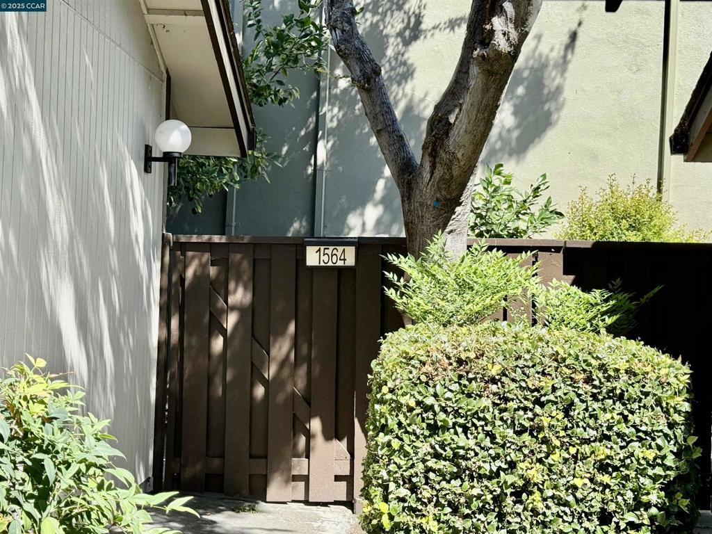 Wonderful townhome recently painted with new stove, granite counter tops, dining room, formal living room with hardwood floors, fireplace, 3 good size bedrooms, 2 full baths and 1 half bath. Inside laundry with washer and dryer. Large 2 car garage. Front patio with a lemon tree, and a nice back patio with a fig, plum & persimmon tree. Community pool with club house. Right out your back gate is a gazebo and lawn area for entertaining. Conveniently located near shopping, dining, transportation, freeway, schools, walking & biking trails, BART and more. Move in and enjoy.