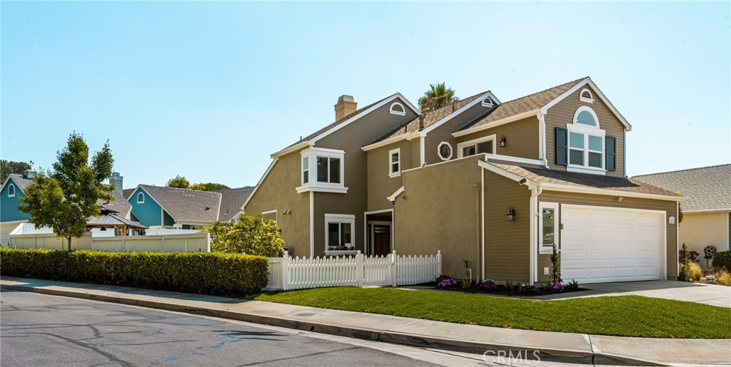 Welcome to a home of unparalleled elegance, where the level of upgrades and attention to detail is rarely found. This extraordinary, charming corner-lot home is nestled in one of the most sought-after neighborhoods in Mission Viejo, near the lake. It offers 1,540 square feet of living space with an exceptionally spacious backyard, no Mello-Roos, and a low tax rate—truly a rare find and incredible value. As you pass through the front yard, with its ample grass space providing a welcoming first impression, and enter through the custom wooden door, you are immediately greeted by soaring ceilings and an open floor plan. To your left, the designer kitchen showcases high-end built-in appliances, quartz countertops, and an abundance of custom wood cabinetry. Every detail in this kitchen, from the exquisite finishes to the high-end materials, has been carefully chosen for both beauty and function. A dedicated breakfast nook adds a perfect corner of comfort and charm to this exceptional space. The home is flooded with natural light, and the windows and doors lead out to the backyard. The open floor plan flows into the spacious living room and dining area, perfect for entertaining. Upstairs, a modern staircase leads to three spacious bedrooms, including a master suite with a huge balcony and a meticulously renovated bathroom, plus two large bedrooms with another thoughtfully updated full bath. The home also features recessed lighting throughout, a new HVAC system, new windows, and an epoxy-finished garage for added convenience. The large backyard is perfect for entertaining, with meticulous landscaping and a variety of seating areas, including a charming gazebo. This peaceful, safe, and beautiful neighborhood is located near award-winning schools, top shopping, and restaurants, offering luxury and charm at its finest.