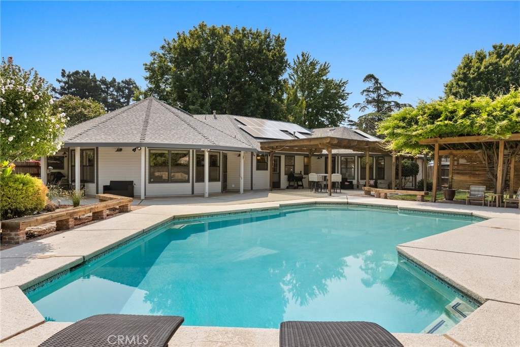 Stunning custom home on serene 1-acre lot in desirable cul-de-sac. A unique place to call home, this private, spacious sanctuary feels remote yet is perfectly nestled in the heart of it all.
Single-story home built with practicality, comfort, & entertainment in mind. One-of-a-kind floorplan, designed to ensure a seamless flow throughout. Open concept living space & oversized bedrooms are both spacious & cozy, every room effortlessly flows into the next. An abundance of storage throughout the home & adjacent structures.
Chef’s dream kitchen includes quartz countertops, eating bar, large island, prep sink, built-in wall combo convection oven, six-burner gas range, touch-activated faucet, reverse osmosis drinking water dispenser with a whole-house sediment filter & water softening system. Separate wet bar with sink, breakfast nook and formal dining.
Laundry/craft room is an unparalleled feature: two separate walk-in pantries, a coat/utility closet & a convenient quarter bathroom, built-in cabinetry, a large island with quartz countertops, built-in laundry hampers and ironing board. A large utility sink, hookups for double stackable W/D, a built-in desk, quartz countertops, & numerous drawers.
Cultivated grounds are unmatched and include a huge inground saltwater pool, babbling brook, raised garden beds & bountiful, mature fruit trees.
Oversized two-car detached garage/shop, covered carport, built-in cabinets, a workbench, utility sink with extra counterspace, and attic storage accessible via a built-in dropdown ladder. The mini-split Heat & A/C system, circuits for EV, RV, & welding.
Two-car garage attached to the house, includes built-in cabinetry, workbenches, a utility sink, & a niche for a refrigerator/standup freezer.
Owned solar panels, EV charging, ample RV parking. Two 90% efficient HVAC systems, maximum attic insulation, a whole house vacuum system, & a Quiet Cool whole house fan.
Square footage is based on the original building plan; Buyers, agents, & all parties to inspect and verify all information to their satisfaction. Seller is a licensed Realtor.
Escrow Pre Open with Mid Valley Title and Escrow: Alexis McAfee and Jenna Olson