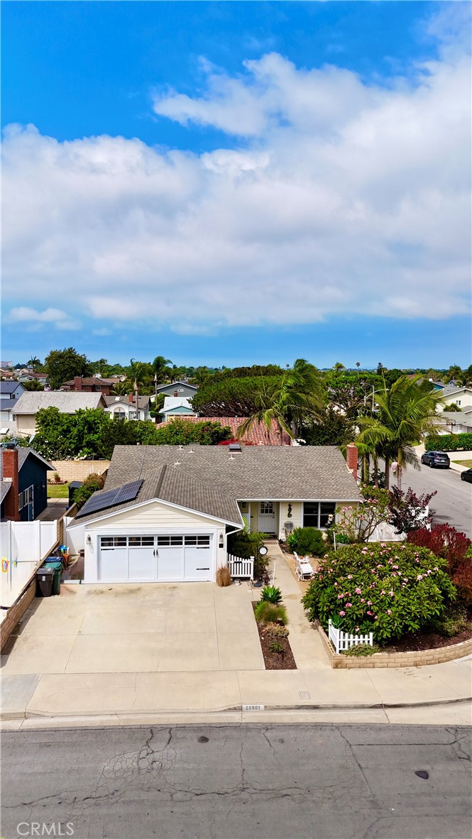 WELCOME TO HUNTINGTON BEACH!! RIDE YOUR BIKE TO THE STUNNING PACIFIC OCEAN IN MINUTES FROM YOUR AWESOME BEACH HOUSE!! THIS HOME SITS ON A CORNER LOT AND IT IS IN A VERY DESIRABLE NEIGHBORHOOD. THE FRONT SHOWS PRIDE OF OWNERSHIP WITH LUSH LANDSCAPE AND AN AREA TO SIT AND RELAX WITH FRIENDS. YOUR FRONT DUTCH DOOR WELCOMES YOU TO A NICE OPEN FLOOR PLAN WITH CUSTOM FLOORING THROUGHOUT!! THE FAMILY ROOM HAS LOTS OF WINDOWS, A SIDE GLASS DOOR AND A COZY FIREPLACE FOR THOSE CHILLY WINTER EVENINGS. THE KITCHEN IS BIG WITH RECESSED LIGHTING, SLANTED CEILING, LOTS OF CABINET SPACE, CUSTOM CHERRY COUNTER TOPS, A FARMHOUE STYLE SINK WITH INSTANT HOT WATER AND A BIG ISLAND WITH QUARTZ COUTNER TOP AND IT FLOWS NICELY INTO YOUR DINING AREA FOR THOSE NICE FAMILY MEALS. THE BEDROOMS ARE SIZED WELL WITH GOOD CLOSET SPACE AND CEILING FANS, THE BEDROOM AT THE END OF THE HALL IS LARGER WITH IT'S OWN SLIDER TO THE SIDE YARD. THE HALLWAY BATH HAS MARBLE FLOORING, CUSTOM TILE AND A SKYLIGHT THAT HAS A RAIN SENSOR THAT SHUTS WHEN NEEDED AUTOMATICALLY!! THE HALLWAY CLOSET IS PERFECT FOR LINENS, STORAGE AND MADE WITH CEDAR. THE MASTER BEDROOM IS LARGE WITH ITS OWN SITTING AREA, MIRRORED CLOSETS, CEILING FAN AND IT'S OWN SLIDING GLASS DOOR!! THE MASTER BATH HAS CUSTOM MARBLE FLOORS, DOUBLE FREE STANDING SINKS, TILE SHOWER, NATURAL LIGHTING THROUGH THE SKYLIGHT ALSO WITH AUTOMATIC RAIN SENSOR AND EXPOSED CEILING BEAMS WHICH GIVE IT BEAUTY AND A NICE OPEN FEEL. STEP THROUGH YOUR FRENCH DOORS AND ENJOY YOUR LUSH TROPICAL BACKYARD WITH A WELCOMING GAZEBO FOR RELAXING AND ENTERTAINING RIGHT NEXT TO THE SOUND OF A CUSTOM ROCK WATER FOUNTAIN! THIS LOW MAINTANCE YARD IS ON A DRIP SYSTEM AND OFFERS POSSIBLE RV ACCESS WITH LOTS OF ROOM FOR KIDS TO PLAY. OTHER FEATURES INCLUDE BLOCK WALL THROUGHOUT THE BACKYARD, SOLAR PANELS, TWO TESLA BATTERY PACKS WITH DUAL CAR CHARGERS IN THE GARAGE, TANKLESS WATER HEATER, NEW PLUMBING THROUGHOUT, NEW ELECTRICAL WIRING, SURROUND SOUND SPEAKERS IN THE FAMILY ROOM, HARD WIRED SPEAKERS IN THE FRONT AND BACKYARD, ATTIC SPACE FOR STORAGE, DUAL FRONT AND SIDE DOORS TO ACCESS GARAGE AND SO MUCH MORE!! CLOSE TO SCHOOLS, SHOPPING AND MINUTES FROM THE BEACH!! COME TAKE A LOOK AT THIS BEAUTY BEFORE IT'S GONE!!!
