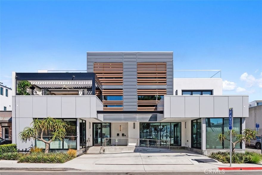 Experience Newport Beach’s ultimate lifestyle in this industrial-modern live/work loft by Brandon Architects, ideally located in the vibrant Cannery area. The 3-level design offers over 3,300 sq ft of living and workspace, highlighted by floor-to-ceiling windows, soaring ceilings, and designer finishes. The gourmet kitchen features rift-oak cabinetry, Miele appliances, and a waterfall island. Enjoy seamless indoor-outdoor living with dual decks, a motorized pergola, and rooftop lounge with firepit. Three en-suite bedrooms include a luxurious primary suite with marble bath and soaking tub. Additional amenities include a custom outdoor kitchen, remote-controlled blinds, 6-car parking, and furnished with Tommy Bahama & Barclay Butera. Walk to Lido Marina Village, cafes, and the beach — a rare blend of design, function, and coastal luxury.
