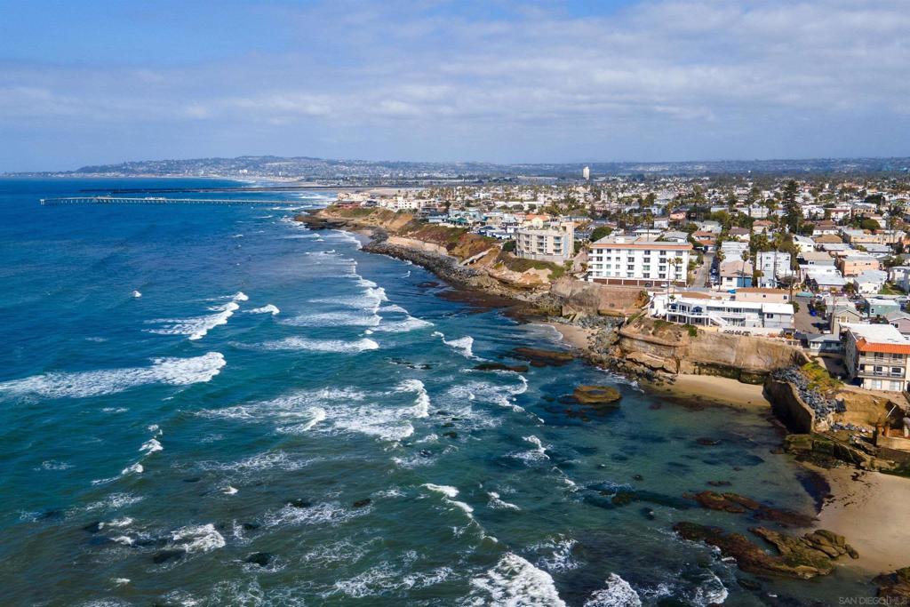 Oceanfront income property in Sunset Cliffs with sweeping views, a rare 4-car garage, and beautifully renovated rental units—offering an exceptional blend of location, flexibility, and lifestyle. Renovations were completed as recently as January 2025, and the entire property has been thoughtfully upgraded between 2020–2025 with new kitchens, baths, windows, and high-end finishes throughout. The front ocean-facing units enjoy private outdoor areas and unobstructed coastal views—one short-term rental was booked 317 nights over the past year. Two rear studios (bonus) are currently operated as long-term rentals. 2024 gross rental income totaled $445K with operating expenses of just $62K. Located just steps from Sunset Cliffs Natural Park, the beach, and neighborhood cafes. A rare opportunity to own a fully renovated oceanfront income property with strong financials and irreplaceable coastal frontage.