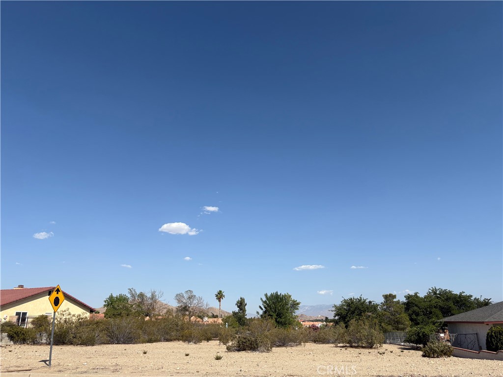 Beautiful Graded Lot in Desert Knolls - Nearly Half an Acre!
This prime, build ready lot is located in the highly sought-after Desert Knolls community. Situated on nearly half an acre, the property is surrounded by both established residences and new construction, offering a strong potential for long term value. Conveniently located near the 15 Freeway, with close proximity to schools, shopping and restaurants--ideal for commuters and families alike. All utilities are adjacent to the property, making it ready for your custom build. A great opportunity for builders or families looking to create their dream home in a thriving, well- established neighborhood.