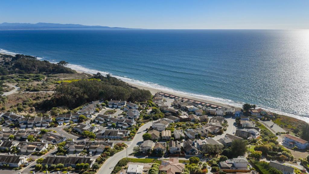 Coastal living made easy at Canon del Sol, less than a 5 minute walk to the beach. This ocean-view residence pairs natural light and indoor-outdoor flow with a true lock-and-leave lifestyle in a quiet La Selva Beach enclave. A neighborhood path brings you to the sand in minutes, and on-site amenities: pool, tennis, and clubhouse; keep an active routine right at home. Inside, calm, sunlit rooms open to a private patio for morning coffee and easy evenings after the beach. Community-managed grounds and common areas help keep weekends free, while practical touches like sensible storage for boards and bikes make coastal life simple. Everyday conveniences are close by at Seascape Village (shops, cafes, market), with quick access to Hwy 1 for Aptos, Capitola, and Santa Cruz. Trails and open spaces abound from seaside paths to The Forest of Nisene Marks; so its effortless to move, then unwind. Whether you're seeking a primary residence or a weekend escape, this home delivers the Canon del Sol balance of proximity and privacy: beach, amenities, and ocean views; without the heavy upkeep.