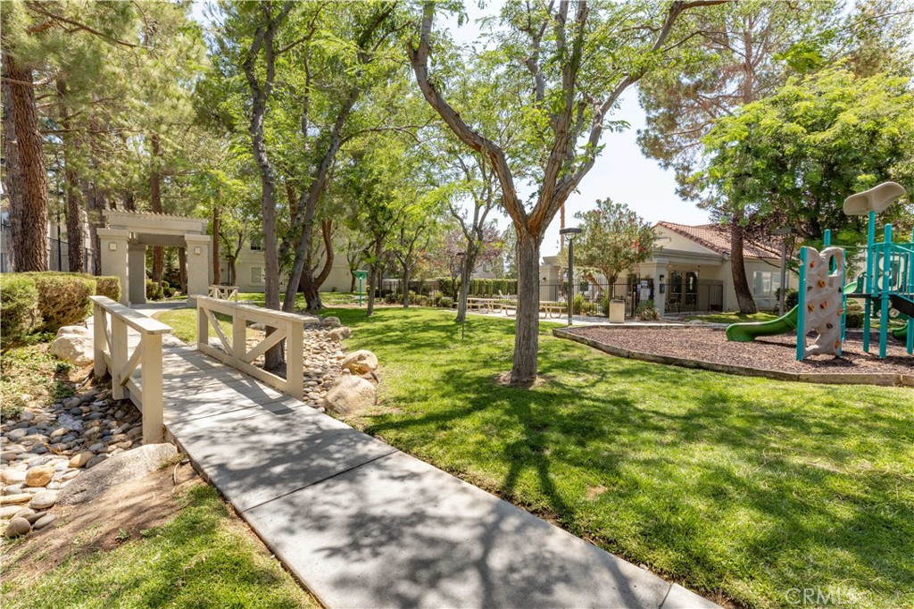 This bright and well-maintained 3 bedroom, 2 bath condo features laminate flooring, quartz countertops, in-unit laundry, and a cozy fireplace. Step out onto the shaded balcony and enjoy a peaceful outdoor retreat. A private detached garage offers added convenience and storage.
Located in a gated community with mature trees and grassy areas, residents enjoy resort-style amenities including a pool, spa, gym, tennis court, kids’ jungle gym, and a community laundry room. Located near shopping, restaurants, Antelope Valley College and California State University Bakersfield.