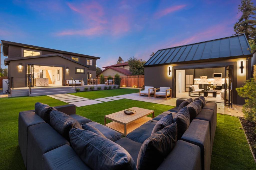 Transcending the boundaries of luxury, the acclaimed Simon Offermann Group elevates architecture into artistry through intentional design, artisanal craftsmanship, and uncompromising detail, unveiling a strikingly re-envisioned 4BR/4BA 2,580 SF residence with a private 1BR/1BA 363 SF guest studio that delivers a truly immersive modern living experience. Sparing no expense, every surface embodies a masterful curation of the worlds finest materials. Grand-scale signature spaces flow across a luminous floor plan, enhanced by lofted ceilings, expansive windows, skylights, and dramatic walls of glass that magnify volume and unite the interiors with the outdoors. Composed as a statement of form and function, the European-inspired kitchens and baths showcase Italian porcelain slab counters, bespoke cabinetry, and Porcelanosa tile from Spain, complemented by premium German appliances and fixtures. Poetically extending the living space, a wraparound deck reveals a sprawling, meticulously landscaped retreat that culminates in a guest studio with a unique address, cathedral ceilings, kitchen, bath, and walk-in closet. Enhancements extend to an attached 2-car garage, indoor laundry, custom Ultra wine storage, all-new electrical, plumbing, HVAC, windows, and an array of elite accoutrements.