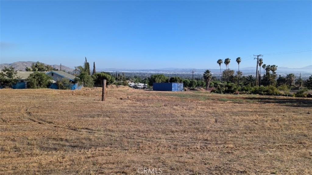 INFILL LOT in Prime LOCATION! 1.77 Acres all flat, usable land north of the 60 Freeway in Moreno Valley! Conveniently located just blocks off Perris Blvd and close to all major shopping and dining hubs. Surrounding homes valued from $550,000 - $1,000,000 while ZONED R2. (Seller also willing to sell just 1/2 acre off the east end of property for $385,000.)
Property can be subdivided into 3 individual parcels of 20,000+ square feet each. Each parcel can possibly contain 1 single family residence plus 1 ADU for a total of 6,000 sq ft of living space, per city of Moreno Valley. (Buyers and their agent to conduct proper due diligence.)
An IN-FILL lot means all utilities are readily available. Ever wonder why some lots seem cheap? Because bringing in utilities can cost you 3 to 5 times what you paid for the lot. Unlike this parcel, which contains two (2) water meters already paid for! Also Electrical, Gas available from the front or back of property. The entire parcel has been graded so you can connect directly to sewer lines on Kalmia or install septic, your choice.
HIGHLIGHTS OF PROPERTY: City Lights from back of property, picturesque mountain views from the front. Hard work already completed which means a more profitable investment. Title Report paid in full. No HOA. This property is priced to sell!
Want to know just how special this parcel really is? Then I recommend you come by at night and just look at the city light views!
Seller will consider all offers!