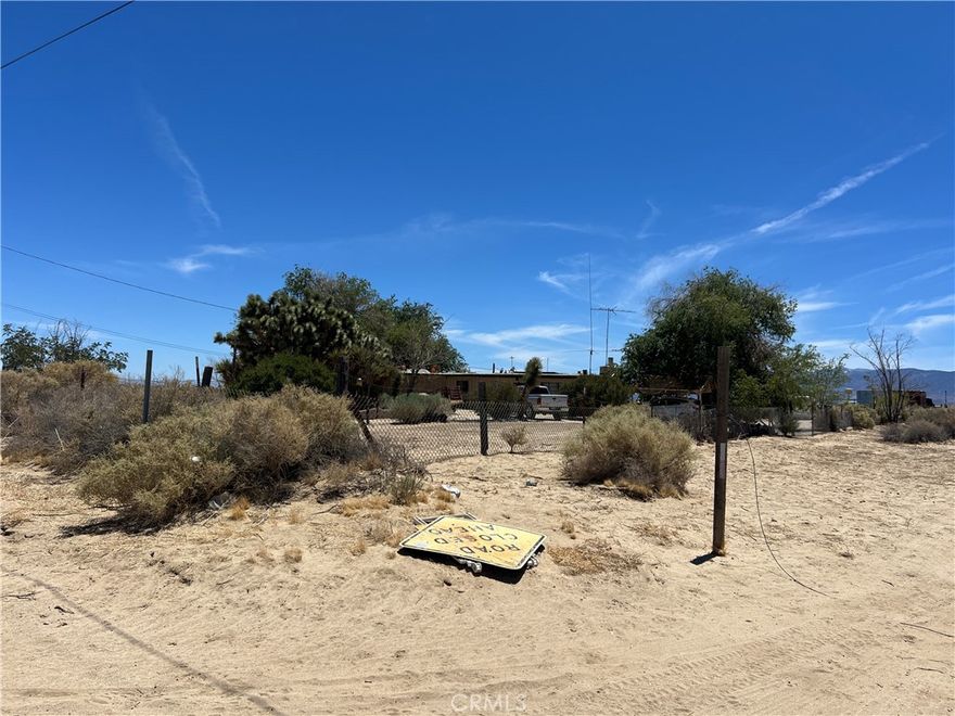 Desert Homestead Retreat on 10 Acres with Expansive Views



Welcome to your desert sanctuary—set on a fully fenced 5-acre parcel with two additional 2.5-acre lots, offering room to expand, invest, or simply enjoy wide open space. This homestead has been thoughtfully enhanced with a 2-car garage, breezeway service porch, and an enclosed patio, providing both function and comfort in a tranquil setting.



A detached barn with mezzanine adds valuable storage and workspace, with potential for an office, art studio, or creative hub. One of the adjoining 2.5-acre parcels even includes a charming “caddy shack”—ideal for guests, recreation, or future use.



Your private well ensures ample water for gardens, trees, or small-scale homesteading. Step outside to stunning San Gabriel Mountain views from the rear of the property, and soak in breathtaking desert sunsets each evening.



This property invites you to embrace your artistic talents, reconnect with nature, and find peace to gather your thoughts—a perfect setting for a writer’s retreat, a creative getaway, or simply a slower, more inspired lifestyle.