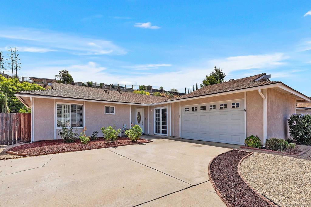 Meticulous single level home in Poway! This carefully maintained, charming home features a remodeled kitchen and remodeled baths, dual pane vinyl windows and doors, plantation shutters, and soft neutral paint throughout. The formal living room is spacious and includes a cozy fireplace. A family room addition with sliding door expands the living space The lovely backyard has a grassy area plus large covered brick and concrete patio, a water feature, and lemon tree. No neighbor directly behind lends a feeling of privacy. The spacious kitchen was remodeled to include granite countertops, attractive tumbled stone backsplash, Kitchen Aid appliances and recessed lighting. In 2024 the sellers replaced the HVAC with an $18K unit with filtration system. The 2 car garage is oversized, with room for storage. Poway is a beautiful community to call home! And no HOA fees or Mello Roos taxes!