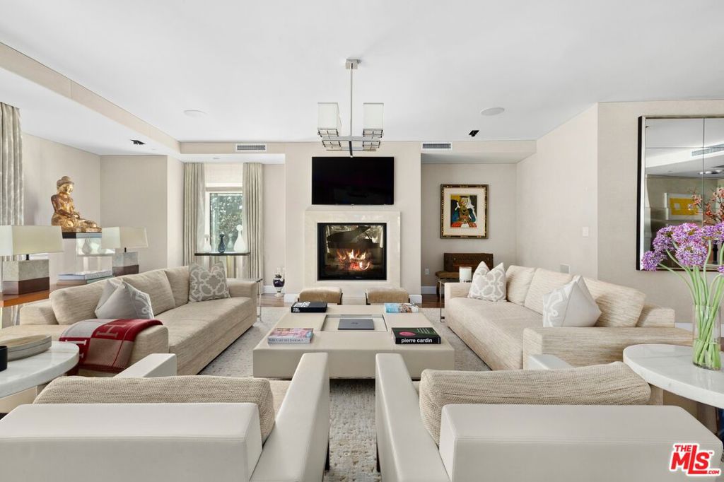 A rare opportunity to own one of Century City's most coveted regal townhouses. Located at the ultra-exclusive, The Century, the property offers four bedrooms and five and a half bathrooms across three levels equating to just over 6000 square feet of premium living space. Entering into the foyer, the open-concept main living space blends dining and living areas into one unified and elegant space. The large, elegant kitchen, complete with a central island and breakfast bar, seamlessly connects to the inviting den, creating a cozy yet sophisticated space for relaxed living. Ascending to the second level, the large landing serves as a central point for the upstairs living quarters. The large primary suite offers an abundance of natural light, featuring outdoor terrace space, dual ensuites and large closets. The three additional spacious bedrooms, all accompanied by ensuite bathrooms further accentuate the property's refined taste. Outdoors, a large wrap-around terrace space frames the rear with multiple lounging areas, a dining space and an outdoor fireplace and barbeque. The lower level of the property serves as a versatile space for a media room, wine room, home gym or recreational area, providing ample opportunities for leisure and entertainment. Enjoy five-star living with access to all premium amenities at The Century with direct access to the amenities floor.