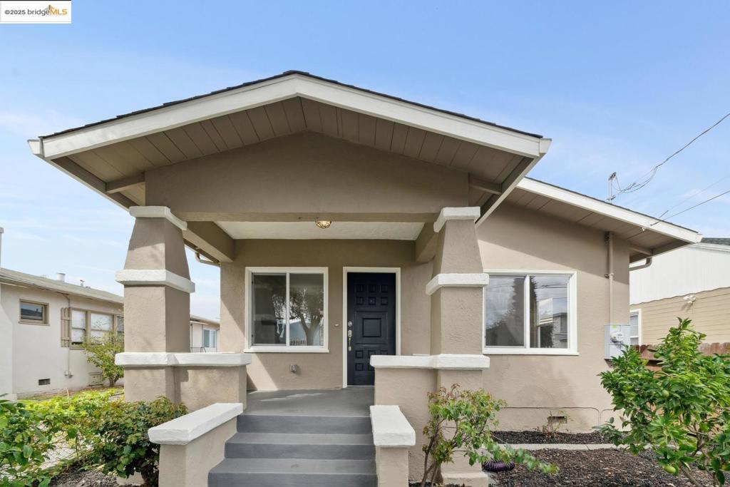 A classic Oakland Craftsman refreshed for modern living. Recent updates include fresh interior and exterior paint, a newly painted fireplace that anchors the living area, and a light fixture that adds character and warmth. The kitchen features brand-new, never-used appliances, a Kraus faucet, and solid shaker doors with updated hardware for a cohesive finish. The bathroom includes a new vanity, framed mirror, and updated fixtures. Outside, a new cedar fence encloses the backyard, where a freshly painted gazebo and mature fruit trees create a serene backyard setting. The wide garage and long driveway provide generous storage and parking options. Additional improvements include a dedicated circuit for EV charging, newer furnace, A/C installation, sewer lateral compliant, an outdoor garden sink, and a quarter bath addition near the gazebo - bringing together comfort, style, and thoughtful function throughout.