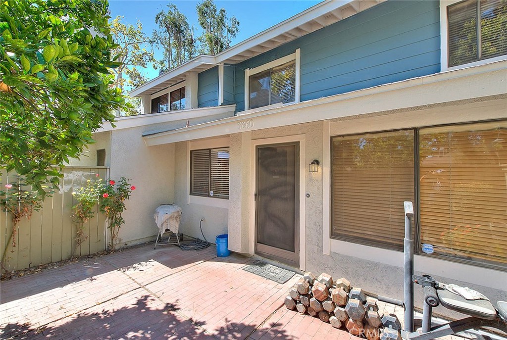 This two-story condo offers 2 bedrooms, 1.5 bathrooms, and a 2-car attached garage with direct access. The spacious living room features a cozy fireplace, and the kitchen overlooks the front patio, perfect for relaxing. Large primary bedroom with high ceilings and a bathroom with double sinks. Both bedrooms come with ceiling fans for added comfort .Laminate wood flooring runs through the living room, kitchen, dining area, and stairs. Located close to shopping, restaurants, schools, and with easy freeway access, this home is well-kept, and move-in ready!