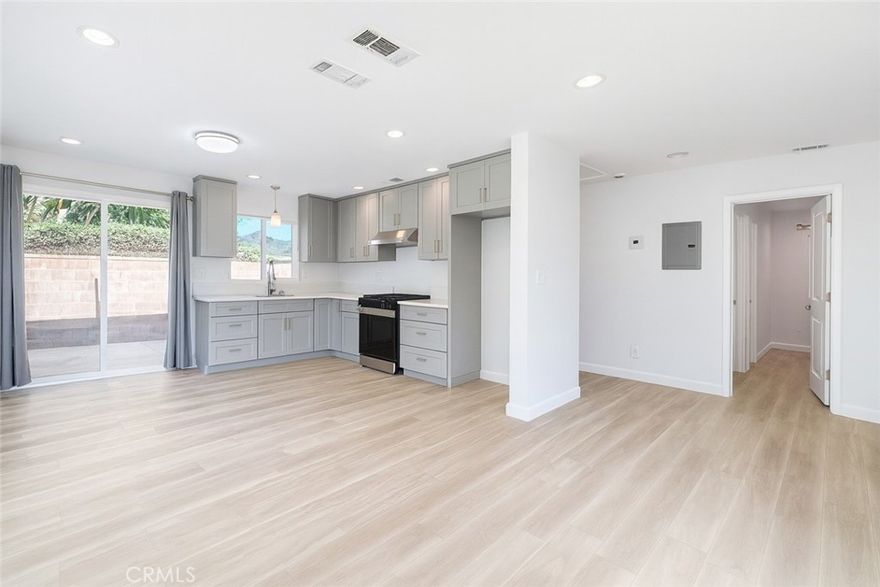 FREESTANDING rear unit of duplex in quiet Central Torrance.  NEWLY remodeled from top to bottom. New insulation, electric, plumbing and sewer.  New central heating system, new tankless water heater.  New wide plank vinyl floor, recessed lights throughout.  New double paned vinyl windows and patio door.  Open floor plan, large living room opens to kitchen.  Kitchen has plenty of cabinets with quartz countertops, large drawers and new stove.  Large dining area with patio door opens to back yard. Two tastefully remodeled bathrooms.  Master bedroom with walk-in closet and another separate closet.  Ceiling fans in both bedrooms.  Relax in your own private large enclosed back yard, like living at a single house.  Your own 1-car garage has a door open to back yard.  West facing large living room windows, cool breeze from ocean.  Sunny and bright. Walking distance to Del Amo Malls, postal office, Torrance Farmers Market and Wilson Park. EV charging: Level 2; NEMA 14-50 (50 amp)