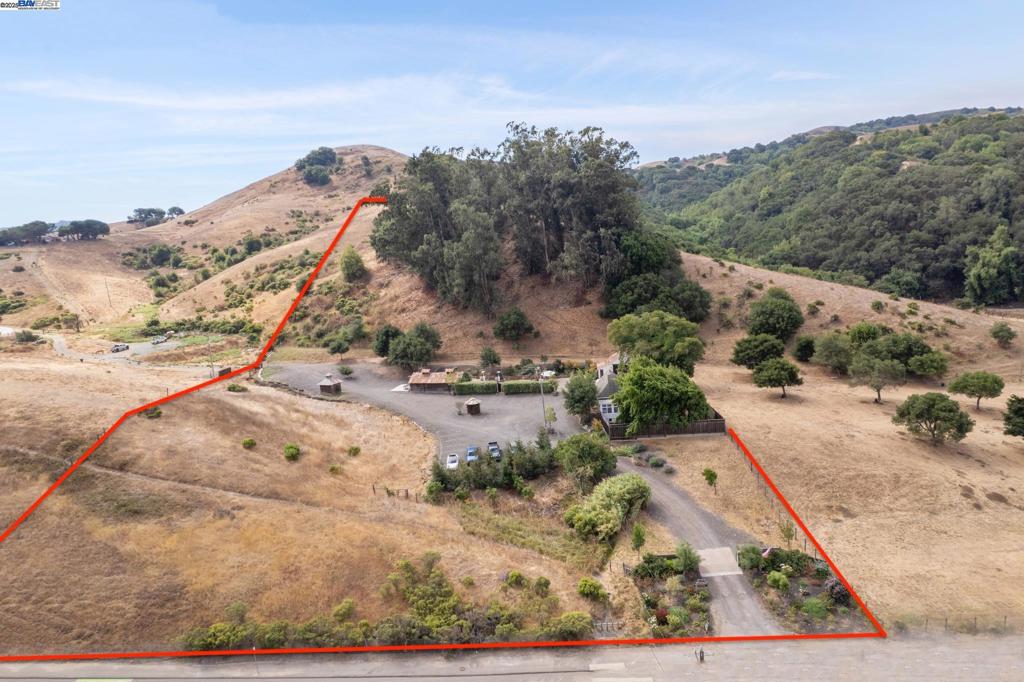 11.86 ACRE ULTIMATE FAMILY COMPOUND - Perfect for Contractor for Storing Equipment/Vehicles, Horses/Livestock, Dirt Bike/ATV Enthusiasts, or Operating Home Office Situation. ZONED AGRICULTURAL. Remodeled 1,050 SqFt Modern Farmhouse & (2) Additional Outbuildings - Barn #1 = 800 SqFt & Barn #2 = 800 SqFt PLUS Option to Expand/Build ADU or New Custom Home (Per State & County Zoning). Home Includes: Open Floor Plan with 3 Bedrooms & 2 Full Baths. New Kitchen Cabinets, Flooring, Quartz Countertops, Tile Backsplash, Stainless Steel Appliances, Oversized Kitchen Island, & Custom Light Fixtures. Updated Plumbing & Bathrooms. SITE FEATURES: Gated Entrance, PG&E, Propane, Septic Tank, (2) Wells, & Fully Fenced Grounds. MEASURE D ALLOWABLE USES: Winery, Brewery, Cannabis, & Olive Oil. COUNTY APPROVAL NEEDED FOR WEDDING, CHURCH, ETC - BUYER TO VERIFY AFTER CLOSE OF ESCROW for County Approved *Business* Ideas. Views: Ridge
