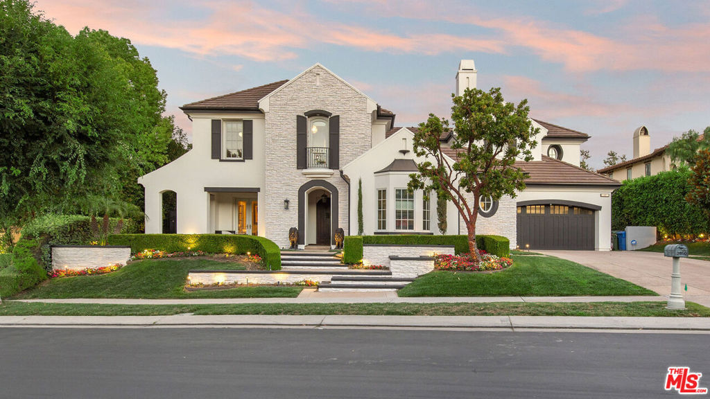 The Exquisite One is Here. The Meadow of the Butterfly | Prado de la Mariposa is a welcoming timeless triumph tailored to a splendid blend of classic detail and contemporary elements, structuring an exceptional and distinguished milestone estate. Behind the coveted guard gates at The Oaks, this highly desired floor plan consists of five spacious bedrooms plus a large bonus den with private access to the European courtyard. The great room is bright and designer-finished with incredible views of the grounds, which are a private oasis.The kitchen features new marble slabs, stainless steel appliances, and is open to the family room, with large custom sliding doors that lead to the outdoor living space. The Primary Suite is a delightful retreat with a newly finished extended private terrace open to the serene panoramic mountain landscape of Calabasas. The updated primary bath will leave you wanting more, and the large walk-in closet, designer-finished, is a private luxury boutique. The outdoor living space is truly exceptional, featuring a luxury barbecue bar, large pool and spa, and beautiful outdoor entertainment and lounge areas. The backyard is a highlight, offering an incredible private fruit and vegetable garden custom-built into the slope with walkway access, perfect for those who love nature and gardening. Additionally, this exquisite outdoor area now includes a new sport court with stunning black and red finishes, ideal for both casual and serious play. Nestled on a beautiful cul-de-sac, the backyard provides a serene environment, facing the conservancy mountain scape, ensuring privacy and tranquility. This passionate accomplishment of style and design is truly unparalleled, offering a lifestyle of luxury and natural beauty.