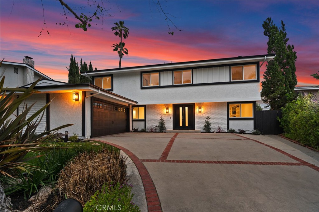 Spectacular panoramic views of the valley, mountains & city lights. Completely remodeled with the perfect blend of comfort, charm & modern elegance. This 5 bedroom 3 bath property has over 2700 sq ft of living space on a lot that is over 10k sq ft and has a private backyard with newer pool & spa, fire pit, lawn & modern decking to enjoy the amazing sunrises/sunsets, including plenty of outdoor space to entertain & avocado, lemon, orange & grapefruit trees. The kitchen is newly remodeled featuring custom cabinetry, quartz counter tops, a center island, all new stainless steel appliances, elegant glass tile backsplash, wet bar with wine refrigerator, breakfast nook, & breakfast bar that opens into the spacious family room. The huge living room has an updated gas fireplace, custom built cabinetry & views. The formal dining room has views & is conveniently located between the kitchen & living room. The primary suite offers views, a custom shower, separate tub with views, quartz counters, dual sinks & a walk-in closet. The other 4 bedrooms are very spacious & are located near the hall bathroom that has dual sinks, quartz counter tops & tub/shower. There is a laundry room with custom cabinets & direct access to the garage that has an electric car charger. Features throughout the interior include beautiful high-end wide planked laminate flooring, crown molding, recessed lighting, dual pane windows, ceiling fans, solar panels & plenty of sunlight. The A/C & heating unit is brand new along with new attic ducting & insulation. The property is fully landscaped, has a large front lawn & oversized driveway. Located near the Victory Trial Head in the original Valley Circle Estates neighborhood on a quiet cul-de-sac & a short distance to the Calabasas Commons, The Village at Topanga, hiking trails, parks, 101 Freeway, 20 minutes to the beach & Pacific Coast Hwy. Award winning schools including El Camino Charter.