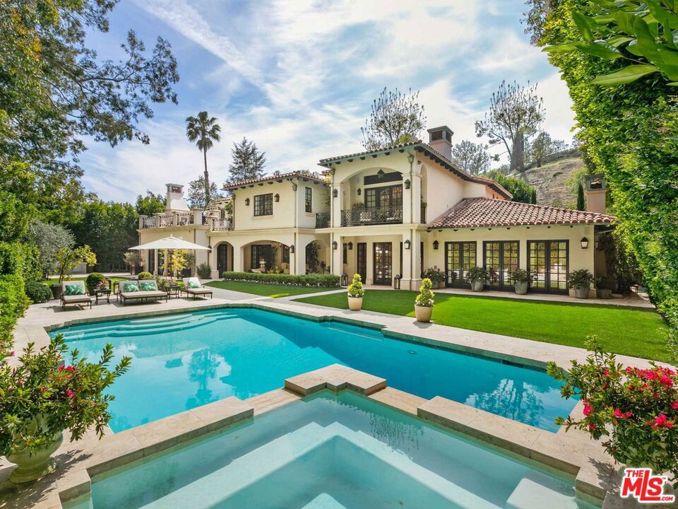 HUGE PRICE REDUCTION!!! PRICED TO SELL!!! Located in prime Beverly Hills proper on lower San Ysidro Dr is a refined and romantic stunning recently remodeled Italian-style celebrity villa located mere minutes from iconic shops, restaurants and The Beverly Hills Hotel. Encompassing seven all-ensuite bedrooms and three powder rooms, this 11,369-SF 3-level gated estate is filled with exquisite design features. The chef's kitchen presents a center island, Viking appliances and a breakfast area. The family room's French doors open to the pristine, resort-like backyard with a pool, hot tub and manicured lawn. Ascend to the second level to find the primary suite with dual closets and spa-like baths. The finished lower level features a bar, a 3,000-bottle wine cellar with tasting room, a 10-seat theater, a gym with a sauna, two bedrooms and a laundry room. Additional home amenities include a 3-car garage. Steeped in exceptional elegance and total privacy, 1156 San Ysidro Drive is a sophisticated retreat conveniently located minutes from the attractions of Beverly Hills and West Hollywood.