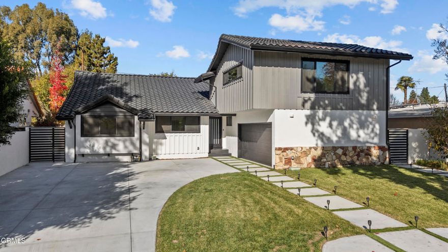 Fully remodeled modern luxury home in prime Sherman Oaks with 4 beds + 4 baths and 2,611 sq ft of beautifully redesigned living space on a 7,770 sq ft lot. This turn-key residence features a bright open floor plan with wide-plank wood flooring, recessed lighting, and large sliders for seamless indoor/outdoor entertaining. The chef's kitchen boasts waterfall-edge counters, high-gloss custom cabinetry, premium stainless steel appliances, and sleek open shelving. A wall of bi-fold doors opens to the resort-style backyard complete with a sparkling pool & spa, brand-new driveway and hardscape, and newly installed landscaping for total privacy.The home offers two primary suites, including a large upper-level suite with a private bath--excellent separation for guests or multi-generational living, and a great candidate for a Junior ADU conversion (buyer to verify). The main-level primary suite includes a custom walk-in closet and a spa-like bath with floating vanities and designer tile. All bedrooms are ensuite with beautifully updated bathrooms.Major upgrades include: new windows and sliders, new stucco and exterior finish, fresh paint inside and out, plus updated finishes throughout. Attached 2-car garage with direct access and additional driveway parking. Located minutes from Ventura Blvd's best restaurants, shops, and convenient freeway access. Move-in ready modern elegance in a prime Sherman Oaks location!