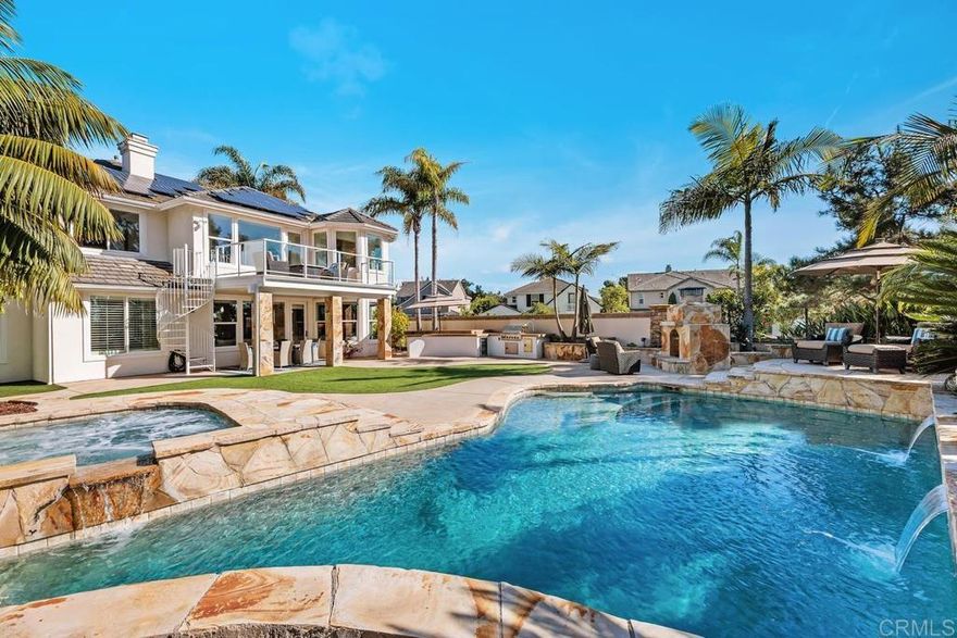 Ocean and Sunset/Sunrise Views from this stunning Standard Pacific, Bay Collection,  Solar Paid Home.  Resort-Style Living Experience with a Lushly landscaped Oasis entertainment design:   Outdoor covered patio with recessed lighting, pre-wired for cable and speakers.  Salt Water Pool/Spa (solar) and outdoor built in BBQ with enormous granite top outdoor island, includes beverage refrigerator.  Custom built stand alone outdoor Fireplace (gas).  Artificial grass in back yard.  Cul-de-sac location.  Main Floor downstairs has a bedroom/full bathroom ensuite and an extra large flex room which can be a bedroom/office/gym or ?  Niche is ready for a closet if wanting a second bedroom downstairs.  Upstairs has 3 bedrooms (one is Primary Bedroom, one is ensuite with full bathroom and a 3rd bedroom which has access to a hall way full bathroom.  Additional loft with attached Office in the round.  Upstairs has laundry room ready for side by side washer/dryer with built in sink.  Primary Bedroom has huge cherry wood, custom organized walk in closet.  Marble throughout primary bathroom with dual sinks and large roman tub and separate shower.  Enjoy sunsets and sunrises off of Primary Bedroom View Deck.  Large Gourmet kitchen with stainless steel appliances, 5 burner stove top, cherry wood cabinets and granite counter tops with back splash.  Beautiful,  newly refinished walnut wood floors extend to most of the downstairs main level.  Double Oven, built in Microwave and refrigerator.  Garage features extra storage cabinets.  Property is on large .39 acre lot!  Just .3 miles to award winning Pacific Rim Elementary School and less than a mile to Poinsettia Park!