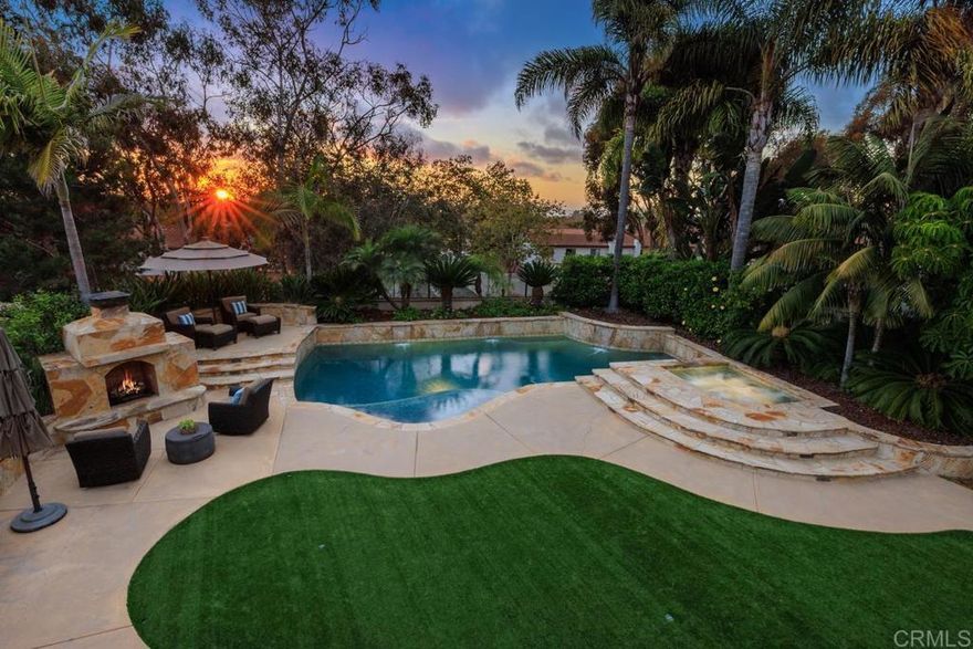 Ocean and Sunset/Sunrise Views from this stunning Standard Pacific, Bay Collection,  Solar Paid Home.  Resort-Style Living Experience with a Lushly landscaped Oasis entertainment design:   Outdoor covered patio with recessed lighting, pre-wired for cable and speakers.  Salt Water Pool/Spa (solar) and outdoor built in BBQ with enormous granite top outdoor island, includes beverage refrigerator.  Custom built stand alone outdoor Fireplace (gas).  Artificial grass in back yard.  Cul-de-sac location.  Main Floor downstairs has a bedroom/full bathroom ensuite and an extra large flex room which can be a bedroom/office/gym or ?  Niche is ready for a closet if wanting a second bedroom downstairs.  Upstairs has 3 bedrooms (one is Primary Bedroom, one is ensuite with full bathroom and a 3rd bedroom which has access to a hall way full bathroom.  Additional loft with attached Office in the round.  Upstairs has laundry room ready for side by side washer/dryer with built in sink.  Primary Bedroom has huge cherry wood, custom organized walk in closet.  Marble throughout primary bathroom with dual sinks and large roman tub and separate shower.  Enjoy sunsets and sunrises off of Primary Bedroom View Deck.  Large Gourmet kitchen with stainless steel appliances, 5 burner stove top, cherry wood cabinets and granite counter tops with back splash.  Beautiful,  newly refinished walnut wood floors extend to most of the downstairs main level.  Double Oven, built in Microwave and refrigerator.  Garage features extra storage cabinets.  Property is on large .39 acre lot!  Just .3 miles to award winning Pacific Rim Elementary School and less than a mile to Poinsettia Park!